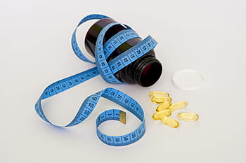 oval, yellow, medication capsules, bottle, tape, pills, medicine, tablet, diet, fat, health